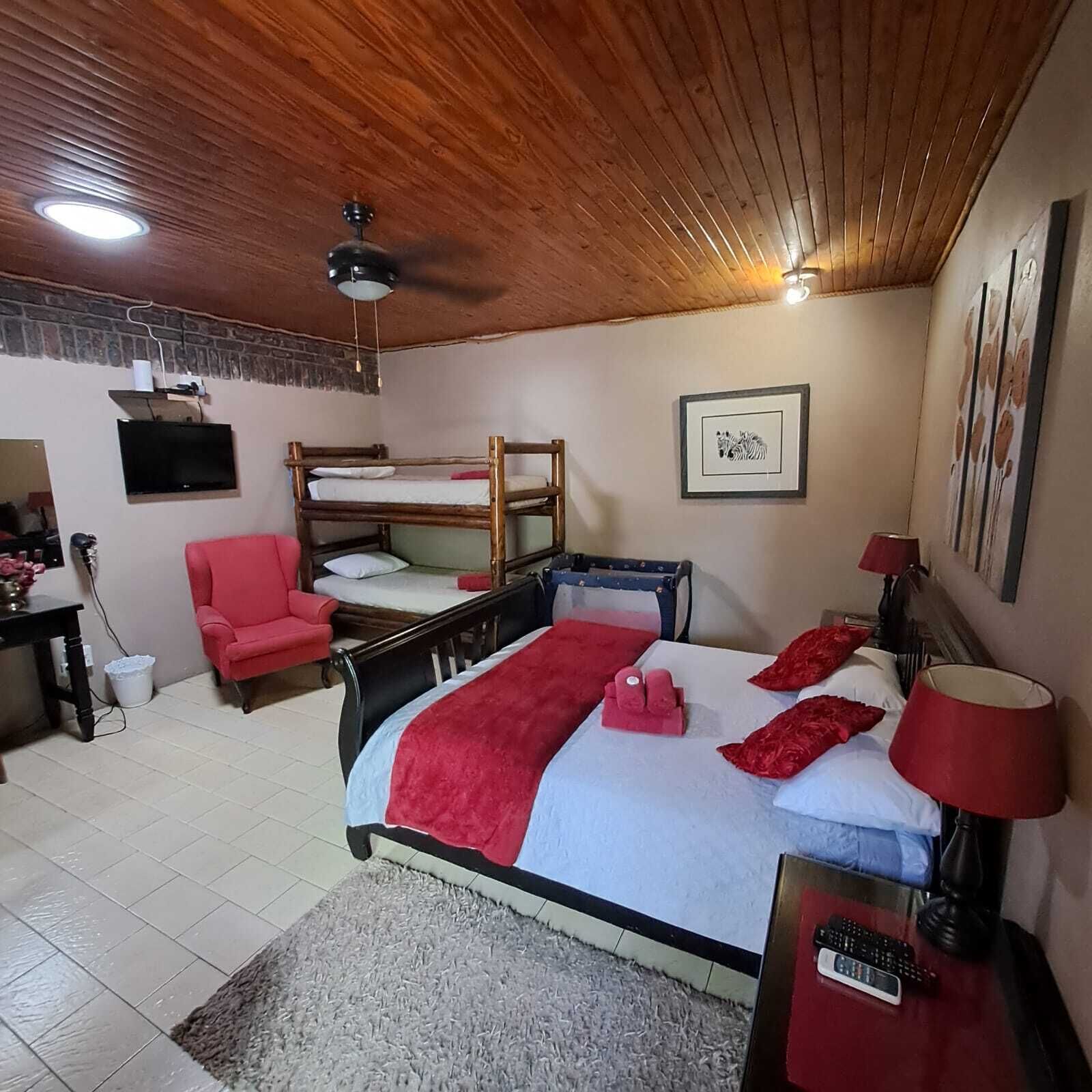 Family Room | Premium bedding, desk, laptop workspace, free WiFi