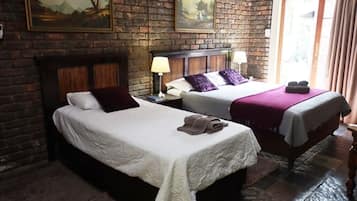 Family Room | Premium bedding, desk, laptop workspace, free WiFi