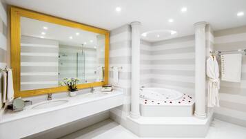 King Suite | Bathroom | Designer toiletries, hair dryer, bathrobes, slippers