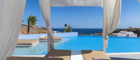 Outdoor pool, free pool cabanas, pool umbrellas