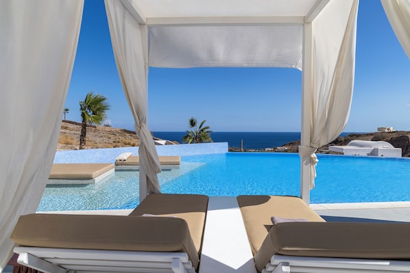 Outdoor pool, free cabanas, pool umbrellas