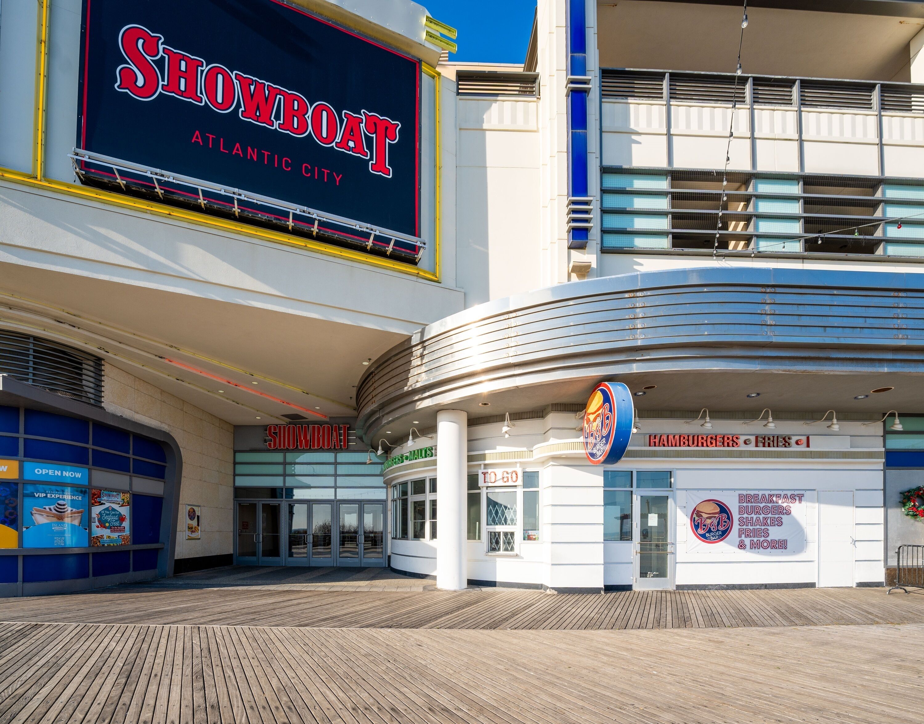 A building with a large sign reading "Showboat Atlantic City" and a restaurant named "Bobby's Malts" offering breakfast, burgers, shakes, fries, and more.