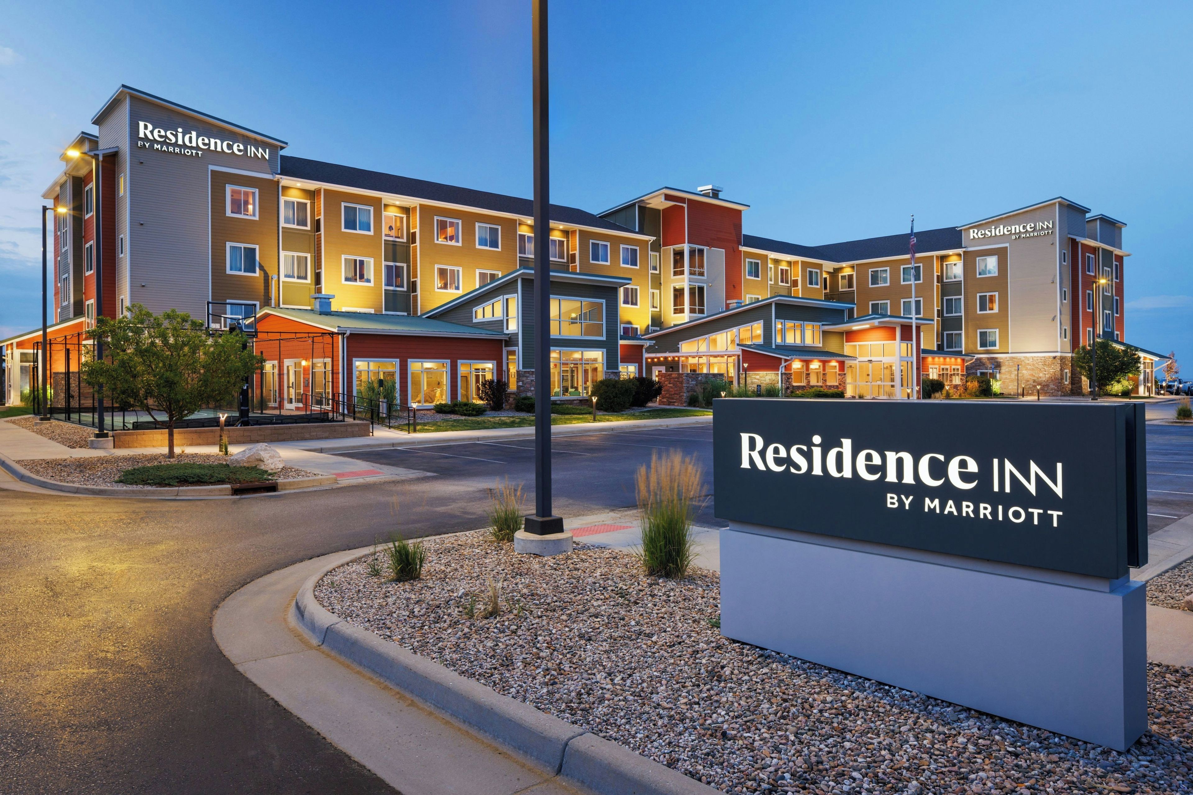 A multi-story hotel with a sign indicating it's a Marriott Residence Inn.