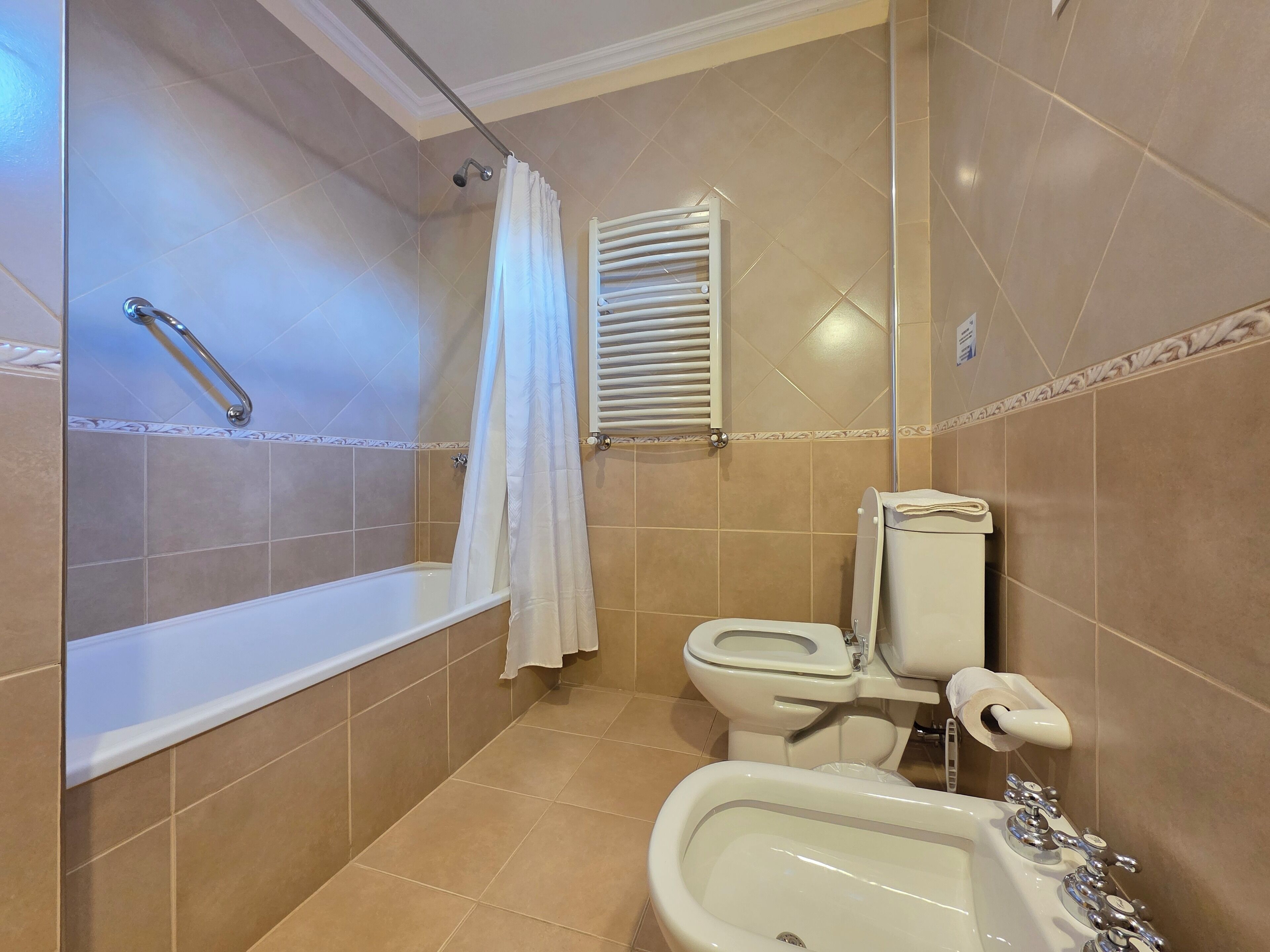 shower, hair dryer, bidet, towels