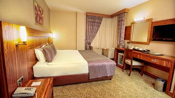 Suite, 1 Bedroom | Minibar, in-room safe, iron/ironing board, free cribs/infant beds
