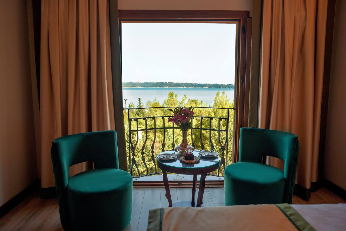 standard double room, lake view | bathroom | free toiletries, hair dryer, slippers, towels