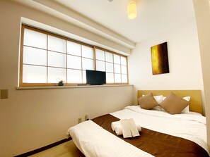 Double Room with Private Bathroom (402) | Desk, blackout drapes, free WiFi, bed sheets