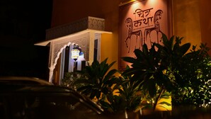 A building with a balcony and a sign with text. - Chitra Katha - A Story Per Stay (Jaipur)