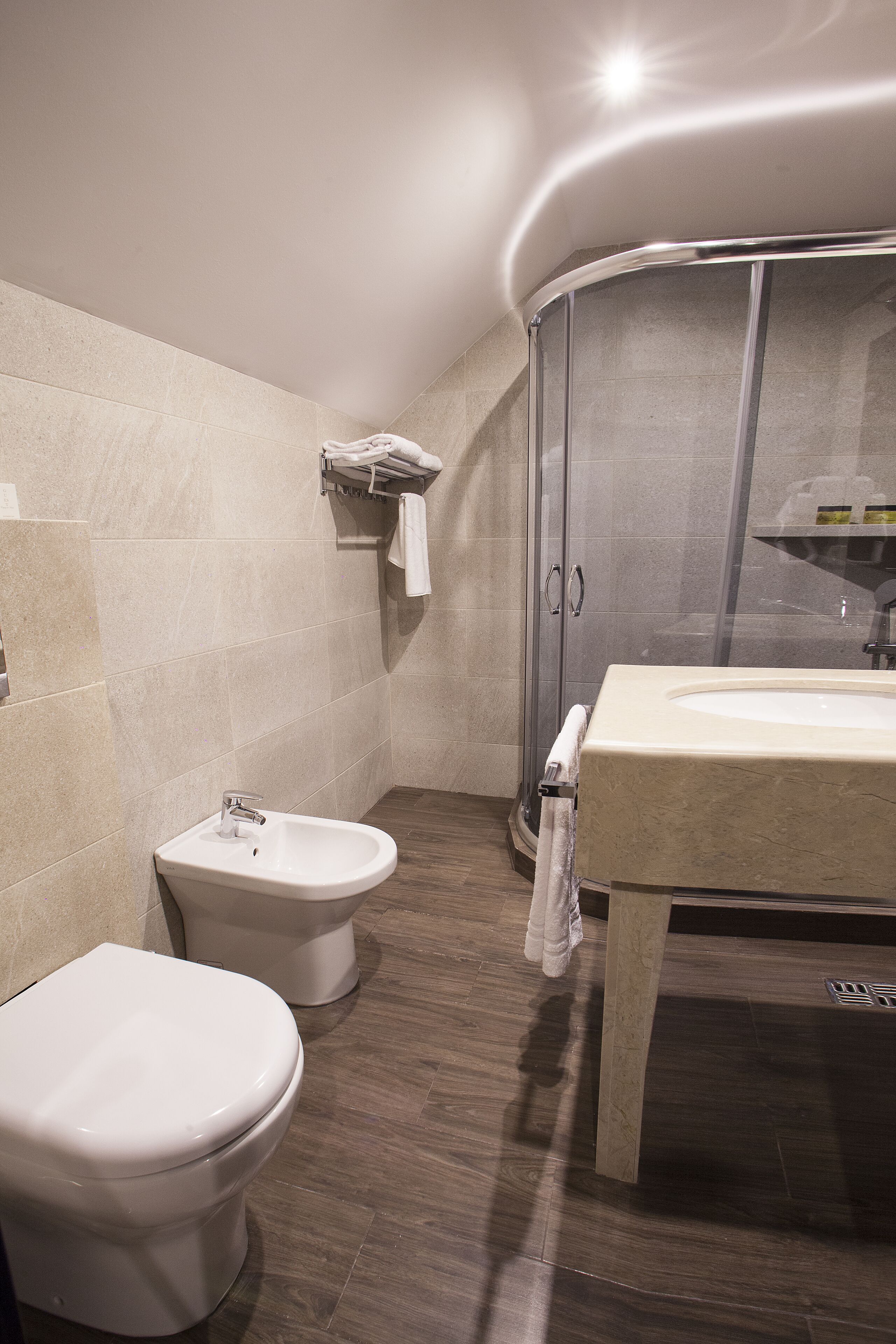 junior suite | bathroom | rainfall showerhead, free toiletries, hair dryer, slippers