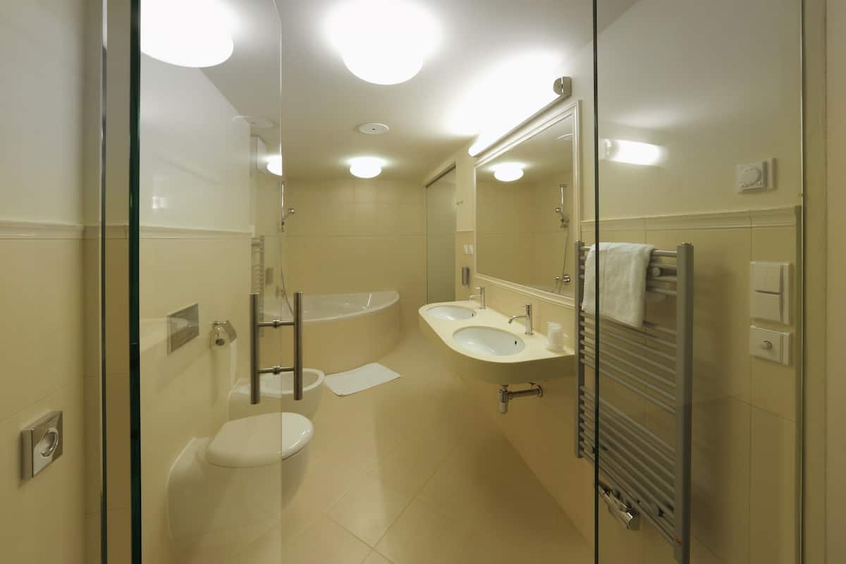 superior duplex, 2 bathrooms | bathroom | shower, hair dryer, bathrobes, slippers