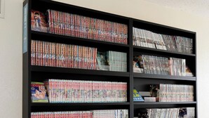 A bookshelf filled with manga volumes.