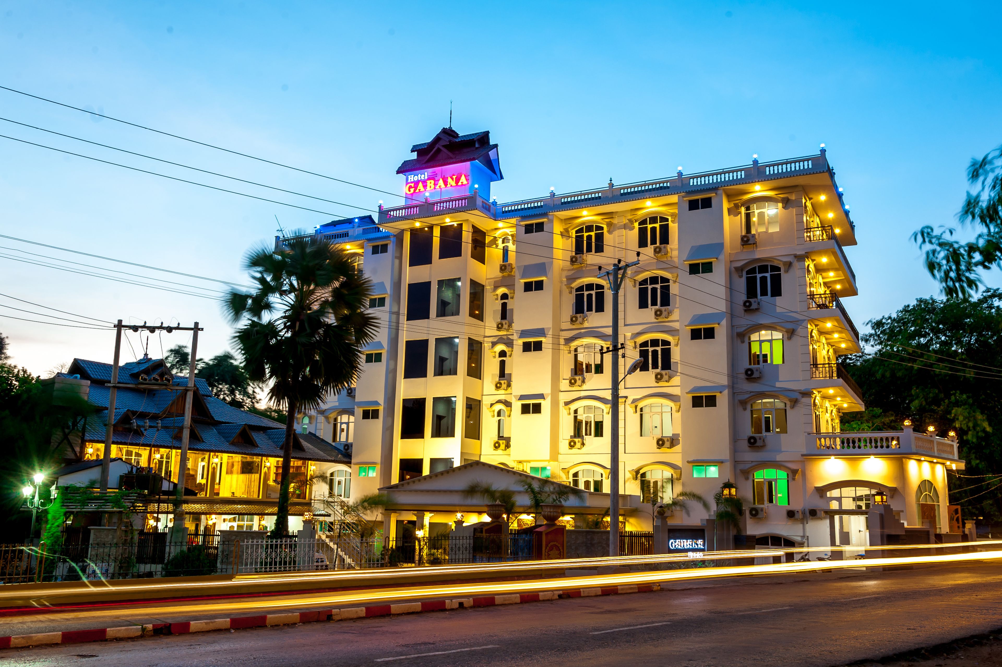 A multi-story hotel with a prominent sign reading "Hotel Gabana."