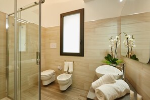 Double Room | Bathroom | Shower, hair dryer, bidet, towels