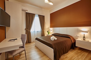 Quadruple Room | 1 bedroom, desk, blackout curtains, cots/infant beds