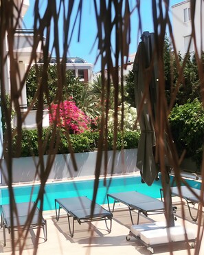 Outdoor pool, open 8:30 AM to 7:30 PM, pool umbrellas, pool loungers
