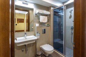 Shower, free toiletries, hair dryer, slippers