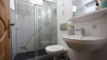 Economy Double Room, Ground Floor | Bathroom | Shower, hair dryer, slippers, towels