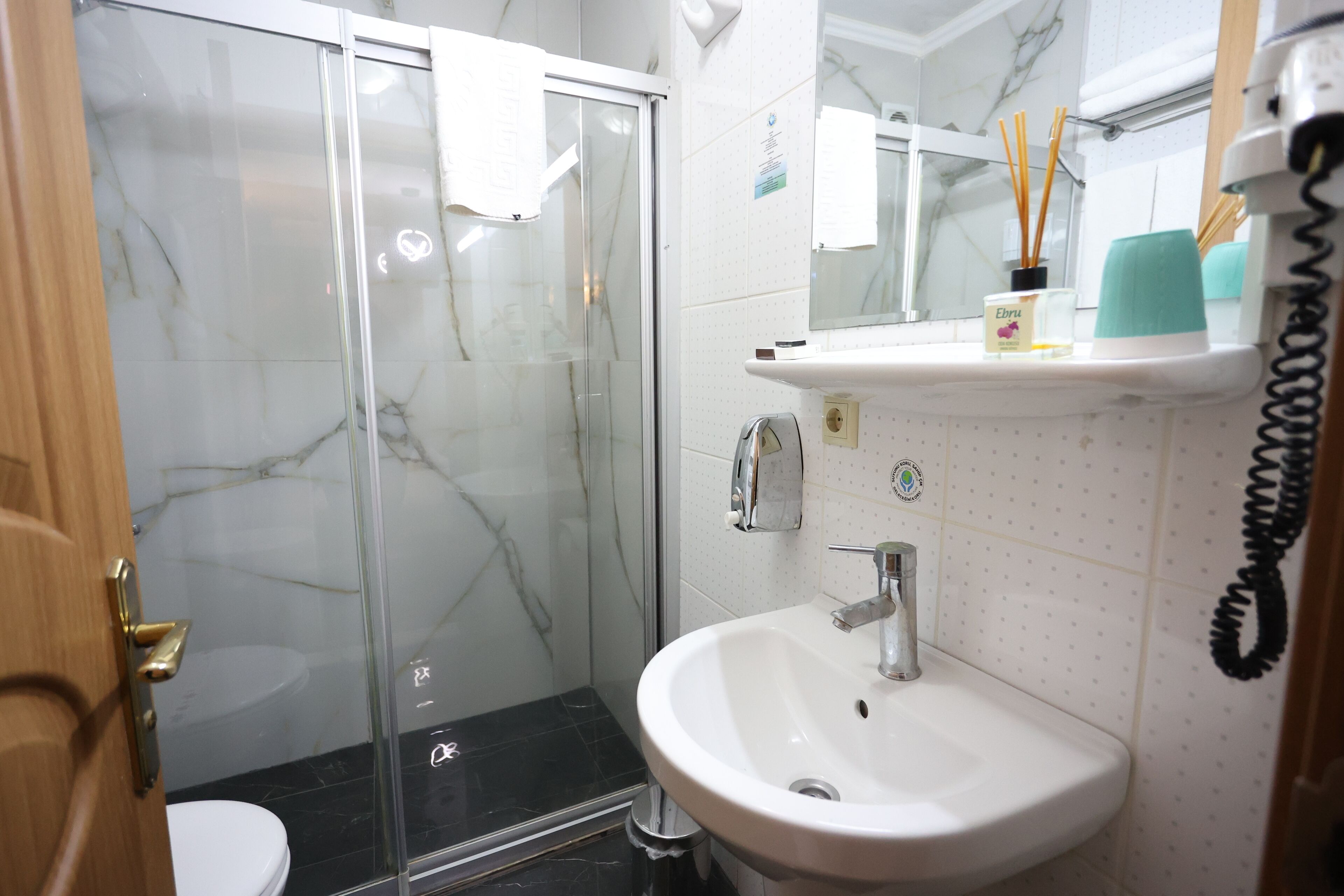 Standard Double Room | Bathroom | Shower, hair dryer, slippers, towels