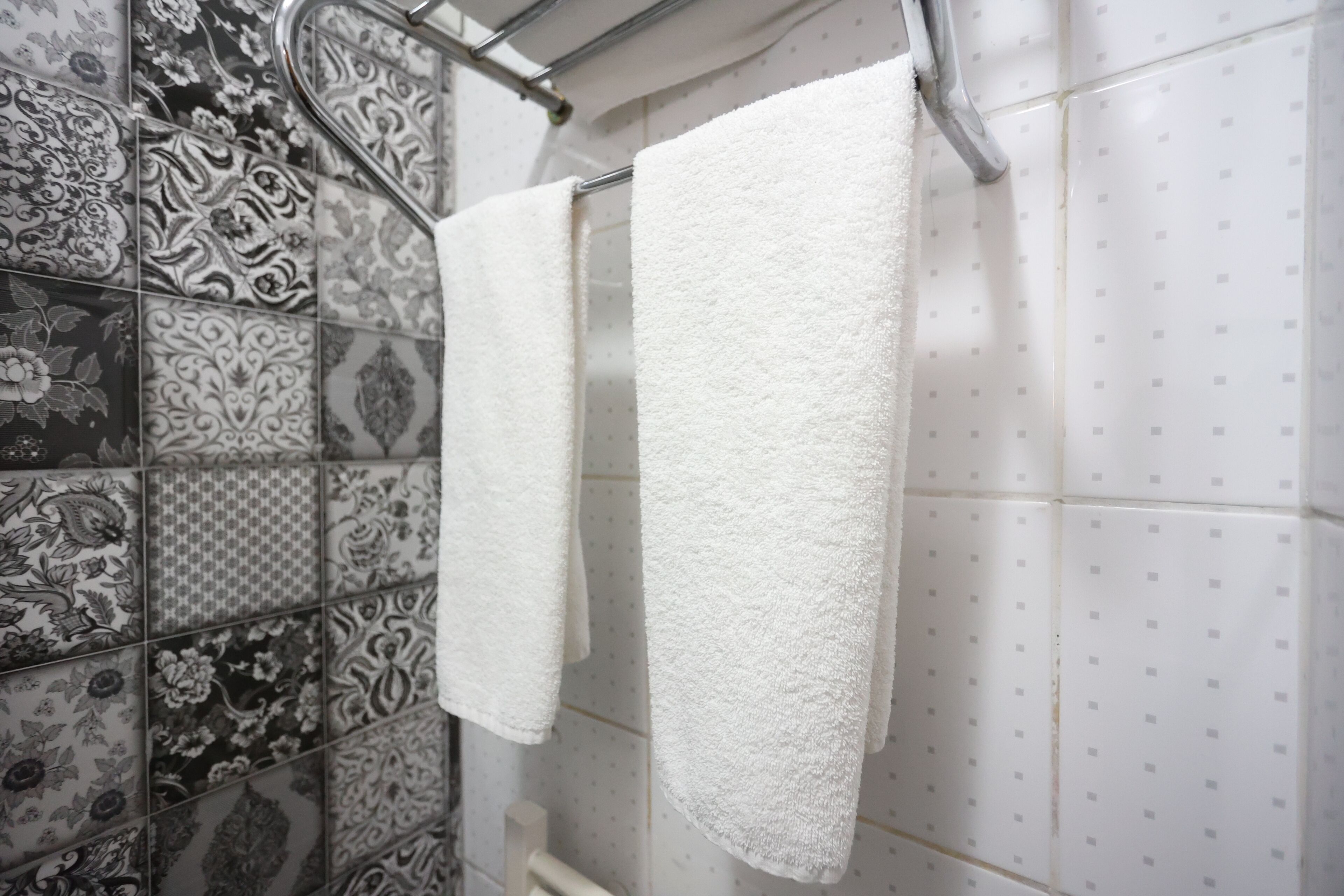 economy triple room basement floor | bathroom | shower, hair dryer, slippers, towels