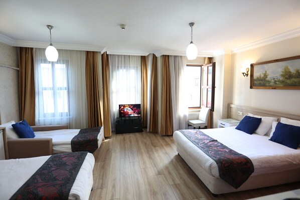 Family Room, 1 Bedroom | Minibar, in-room safe, desk, laptop workspace