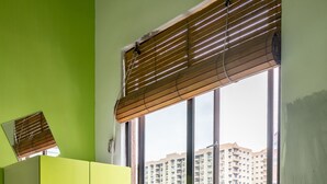 A room with a large window, a green wardrobe, and a bed. - PODs The Backpackers Home & Cafe (Kuala Lumpur)