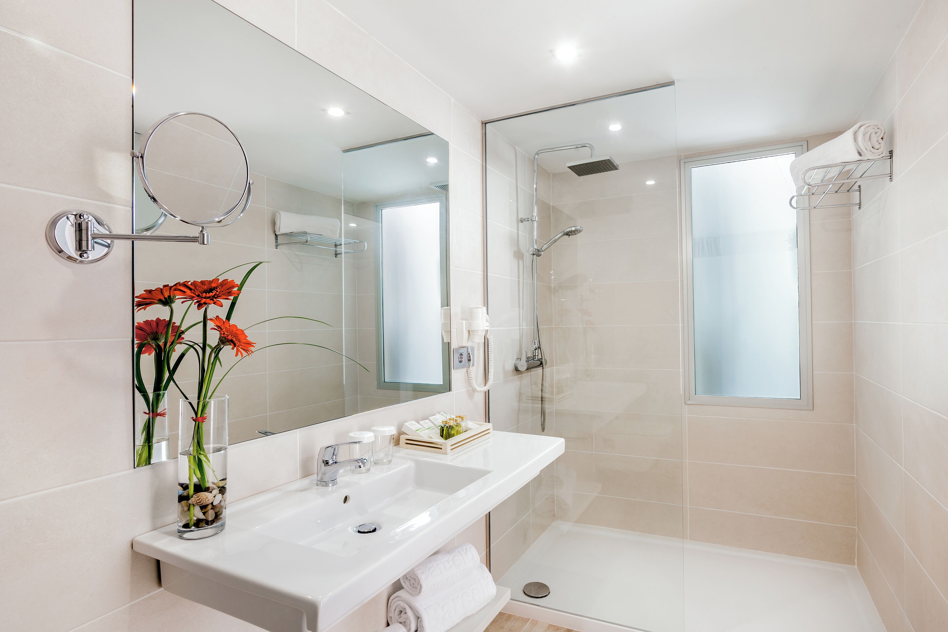 shower, rainfall showerhead, hair dryer, towels