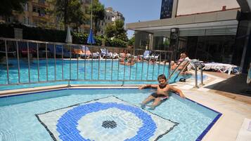 Outdoor pool, pool umbrellas, sun loungers