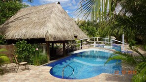 Outdoor pool, pool umbrellas, sun loungers