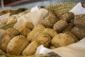 A variety of breads in a basket.