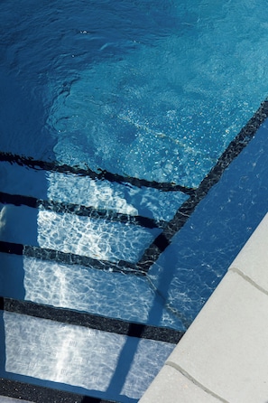 Seasonal outdoor pool, open 8:00 AM to 11:00 PM, pool umbrellas