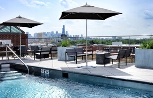 Seasonal outdoor pool, open 8:00 AM to 11:00 PM, pool umbrellas