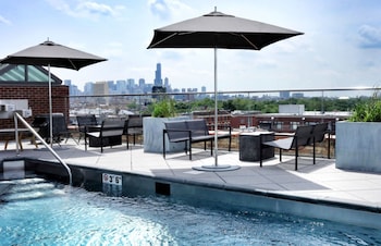 Seasonal outdoor pool, open 8:00 AM to 11:00 PM, pool umbrellas at The Robey, Chicago, a Member of Design Hotels