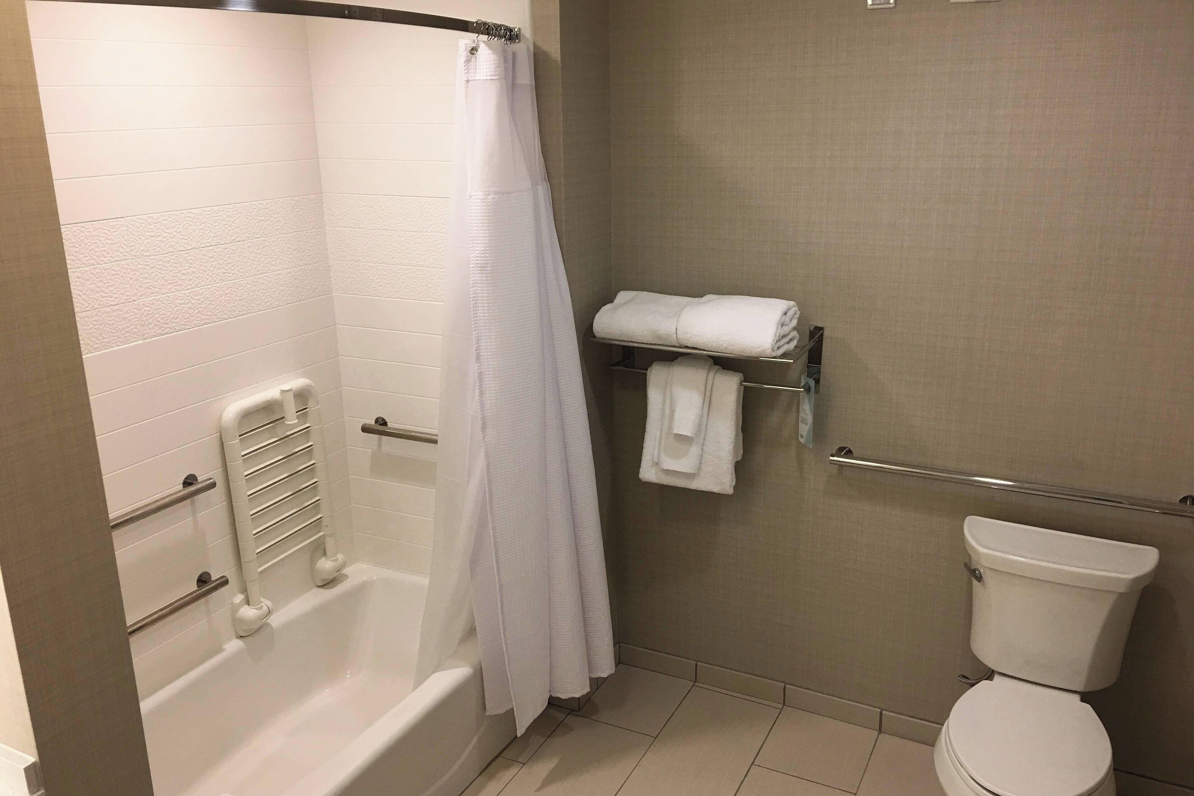 executive suite, multiple beds | bathroom | free toiletries, hair dryer, towels