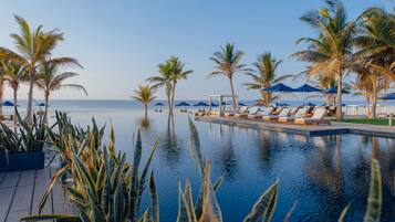 Outdoor pool, open 7:00 AM to 7:00 PM, free cabanas, pool umbrellas