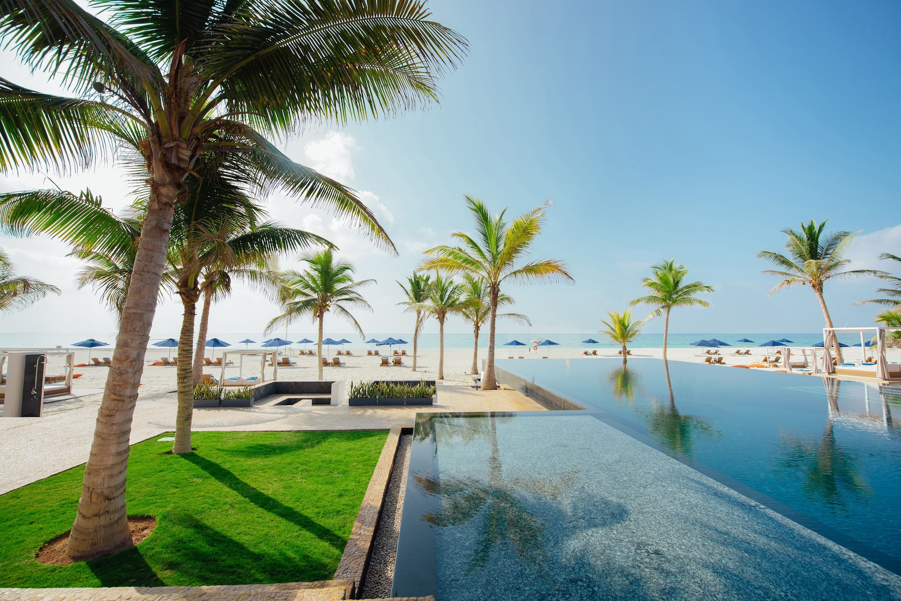 Outdoor pool, open 7:00 AM to 7:00 PM, free pool cabanas, pool umbrellas