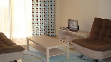 Apartment, 1 Bedroom | Living room | Flat-screen TV