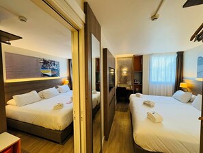 Habitación familiar, 1 cama individual, para no fumadores, habitaciones conectadas | Ropa de cama de alta calidad y caja de seguridad en la habitación