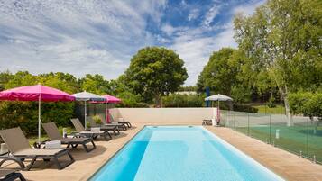 Seasonal outdoor pool, open 9:00 AM to 9:00 PM, pool umbrellas
