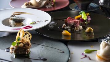 A variety of plated dishes with different colors and textures.