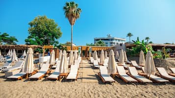 On the beach, free beach cabanas, sun-loungers, beach umbrellas