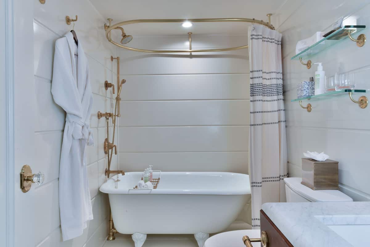 deluxe garden view basement level | bathroom | shower, designer toiletries, hair dryer, bathrobes