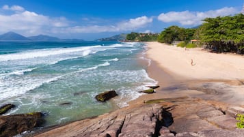 Beach nearby, white sand, surfing