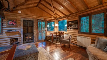 Superior Bungalow, Jetted Tub | Living area | LCD TV, fireplace, DVD player