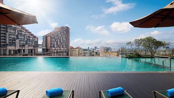Outdoor pool, open 6:00 AM to 8:00 PM, pool loungers