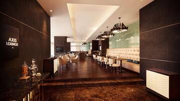 Un área de lounge moderna con barra, asientos y televisor.