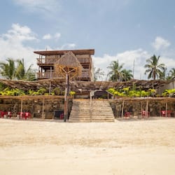 On the beach, white sand, sun-loungers, beach umbrellas