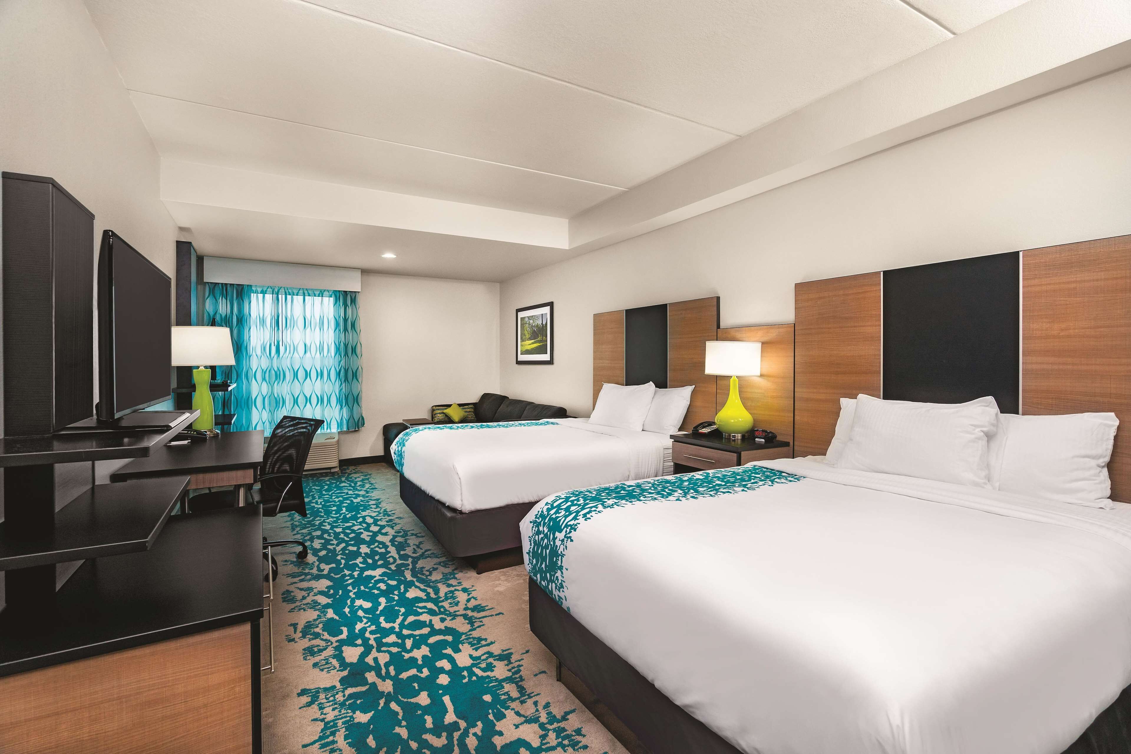 deluxe suite, 2 queen beds, non smoking | premium bedding, down duvets, pillow-top beds, desk