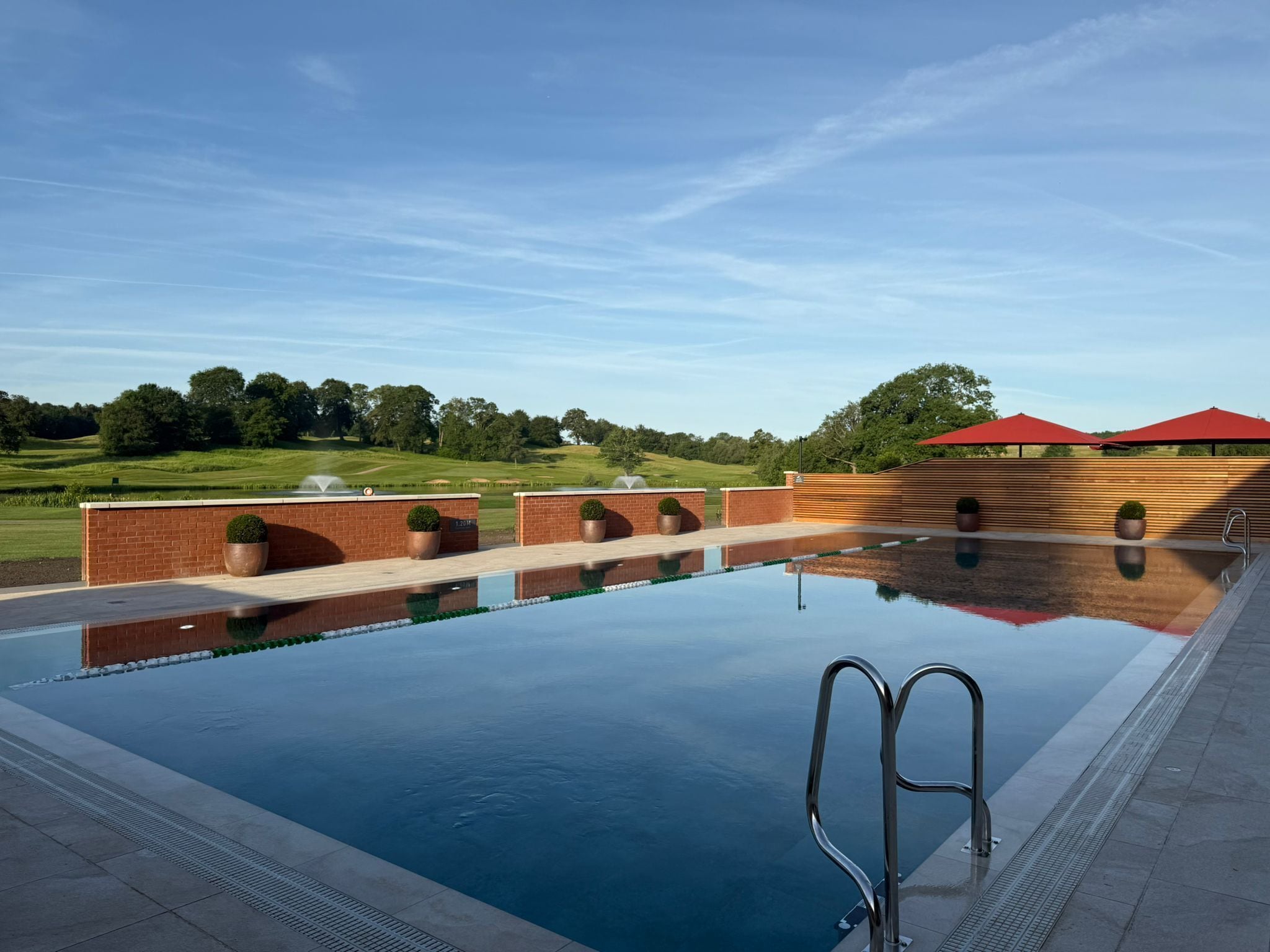 A swimming pool with a clear view of the surrounding landscape.