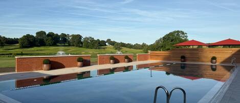 A swimming pool with a clear view of the surrounding landscape.