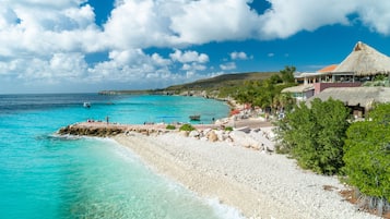 On the beach, sun loungers, beach umbrellas, scuba diving